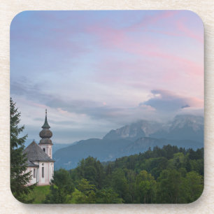 Church with Alps mountains at sunset Coaster