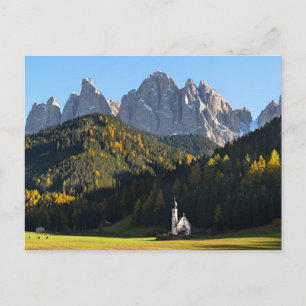 Church with Dolomites mountains postcard