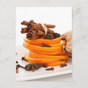 Cinnamon, star anise, cloves and orange slices postcard