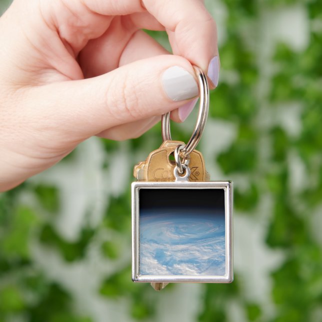Circular Cloud Formation Over South Pacific Ocean. Key Ring (Hand)