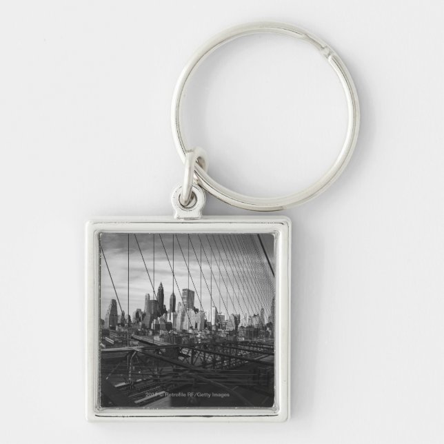 Cityscape through bridge cables key ring (Front)