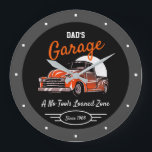 Classic Chevy Truck Garage Dad's Any Name Black Large Clock<br><div class="desc">Dad's or any name garage with 50's Chevy on a black background with orange script and a grey border. Just use the personalise this template option to change the text. Funny slogan typography with any date. Just choose the hand colour and size.</div>