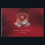 Classic Christmas Floral Crest Monogram Wedding Guest Book<br><div class="desc">Timeless and elegant yet festive holiday-themed wedding design featuring classic hand-drawn gold floral crest accented by a colourful spray of red and white Christmas flowers and evergreens. This custom formal template includes editable text fields as well as an opulent,  ruby red velvet texture background.</div>