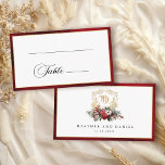 Classic Christmas Floral Crest Monogram Wedding Place Card<br><div class="desc">Timeless and elegant yet festive holiday-themed wedding place card design featuring classic hand-drawn gold floral crest accented by a colourful spray of red and white Christmas flowers and evergreens. This custom formal template includes editable text fields for guest name and table number as well as custom calligraphy text graphics and...</div>