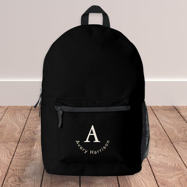 Classic Elegant Monogram Initial Name Black Printed Backpack (An elegant black rucksack, personalized with an initial and name forming a stylish monogram)