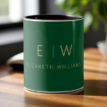 Classic Emerald Green Gold Minimalist Monogram Two-Tone Coffee Mug<br><div class="desc">Enjoy your favourite drink with this classic emerald green gold minimalist monogram two-tone coffee mug. Featuring a rich emerald green background, elegant gold typography, and a sleek modern layout, this personalised mug combines timeless luxury with everyday style. Perfect as a wedding gift, anniversary present, corporate giveaway, or a chic addition...</div>