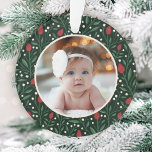 Classic Floral Frame Baby's First Christmas Ornament<br><div class="desc">This beautiful Baby's First Christmas holiday photo ornament features a hand drawn floral and greenery pattern in classic, traditional Christmas colours of red, green, and ivory over a dark green background. A small ivory coloured frame allows your photo to stand out against the background. The back contains text templates for...</div>