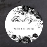 Classic Gothic White Wedding Thank You Round Sticker<br><div class="desc">Introducing the timeless allure of our Classic Gothic White Wedding Thank You Classic Round Sticker design, where elegance meets the ethereal. An enchanting touch of dark romance adorned with intricate botanical motifs, featuring clean white backgrounds embellished with lush peonies and delicate roses that exude a moody sophistication perfect for your...</div>