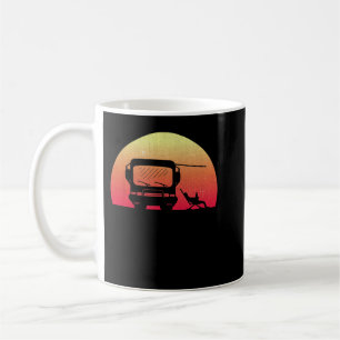 Classic Motorhome at Sunset with Owner sitting out Coffee Mug