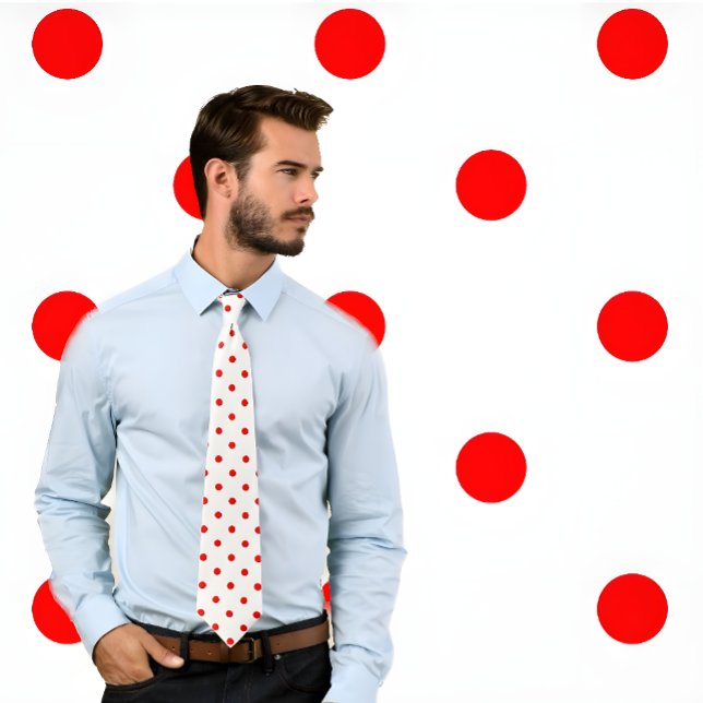 Classic Red Polka Dot Pattern on White Tie (Man wears white necktie with red poka dots. He stands against a pokadot background.)
