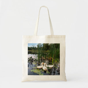 Classic white ducks on beautiful lake tote bag
