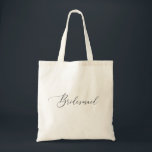 Clean Minimalist Bridal Party | Bridesmaid Wedding Tote Bag<br><div class="desc">This elegant bridesmaid tote bag features delicate calligraphy and a clean minimalist design in classic black and white. It’s the perfect accessory for your bridal party - ideal for carrying essentials on the wedding day, bachelorette weekend, or getting ready morning. A thoughtful and stylish gift your bridesmaids will love and...</div>