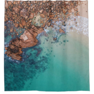Clear blue sea and rocks shower curtain