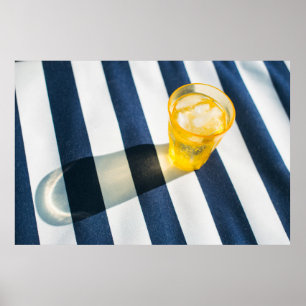 Clear drinking glass with yellow liquid poster