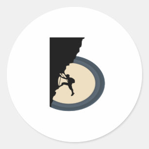 Climbing mountain man at night silhouette classic round sticker
