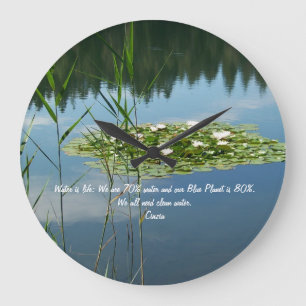Clock with lake and white flowers