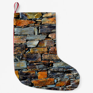 Close-up detail view of an old traditional stone w small christmas stocking