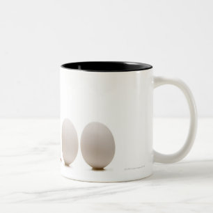 Close-up of a baby chick with three eggs Two-Tone coffee mug