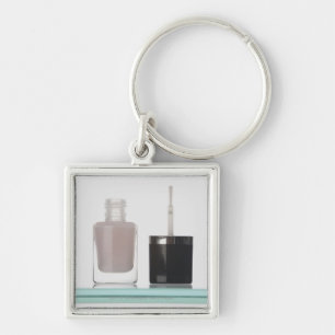 Close-up of a bottle of nail polish key ring