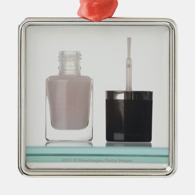 Close-up of a bottle of nail polish metal tree decoration (Front)