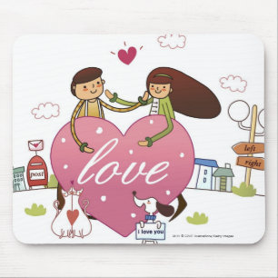 Close-up of a couple holding a heart shape mouse mat