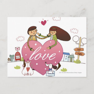 Close-up of a couple holding a heart shape postcard