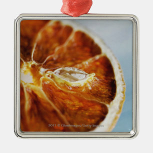 Close-up of a dried slice of lemon metal tree decoration