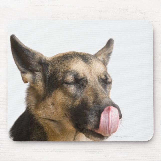 Close-up of a German Shepherd licking its nose Mouse Mat (Front)