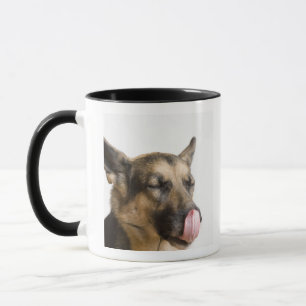 Close-up of a German Shepherd licking its nose Mug