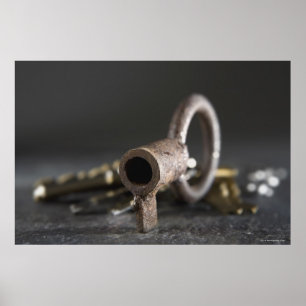 Close-up of a key in a key ring poster