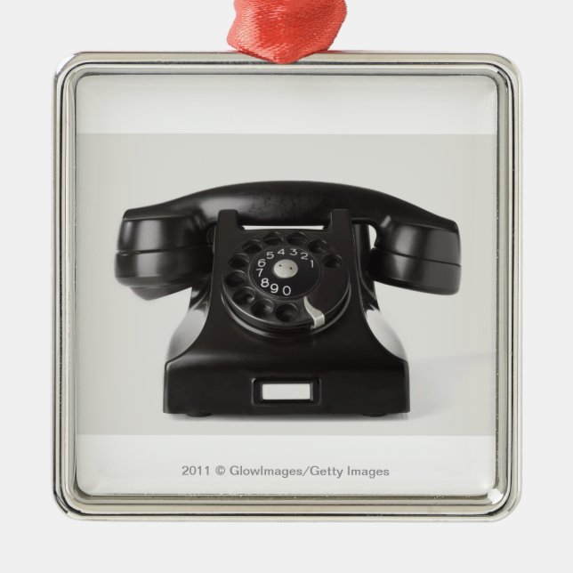 Close-up of a rotary phone metal tree decoration (Front)