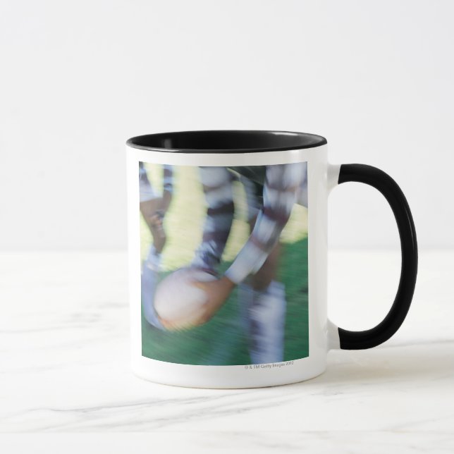 Close up of a Rugby Union Player Passing The Mug (Right)