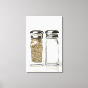 Close-up of a salt and a pepper shaker 2 canvas print