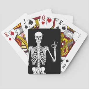 Close-Up of a Skeleton's Okay Gesture Playing Cards