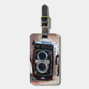 Close-up of an antique camera luggage tag