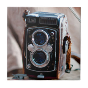 Close-up of an antique camera tile