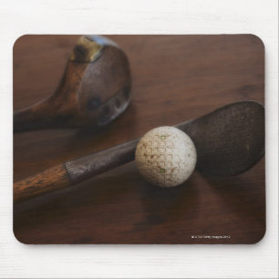 Close up of antique golf clubs and golf ball mouse mat