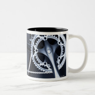 Close up of bicycle chain, pedal and gears Two-Tone coffee mug