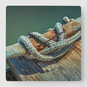 Close-up of boat cleat and rope square wall clock