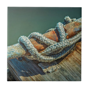 Close-up of boat cleat and rope tile