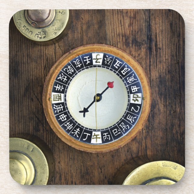 Close Up Of Chinese Compass And Gold Weights Coaster (Front)