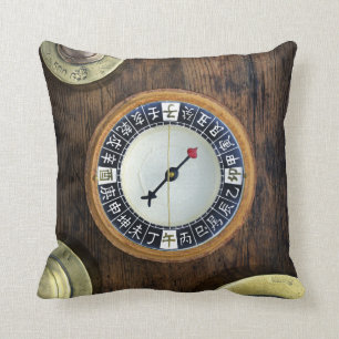 Close Up Of Chinese Compass And Gold Weights Cushion