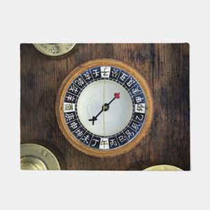 Close Up Of Chinese Compass And Gold Weights Doormat