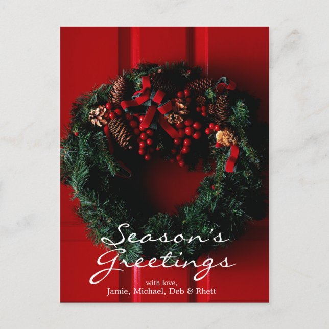 close-up of Christmas wreath hanging on a door Holiday Postcard (Front)