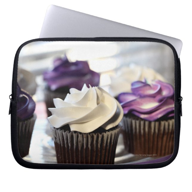 Close-up of cupcakes with selective focus on laptop sleeve (Front)