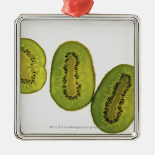 Close-up of five slices of kiwi fruit metal tree decoration