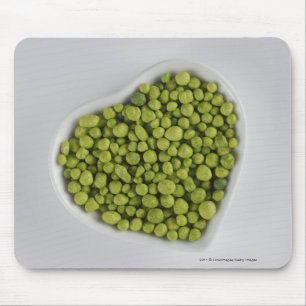 Close-up of green pebbles in a heart shape bowl mouse mat