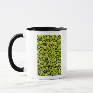 Close-up of green pebbles mug