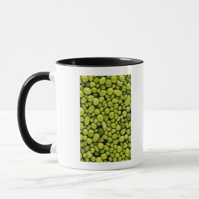 Close-up of green pebbles mug (Left)