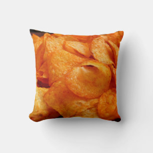 Close up of juicy, crispy, chips on black plate. cushion